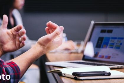 A team in an office discussing sales enablement during a meeting